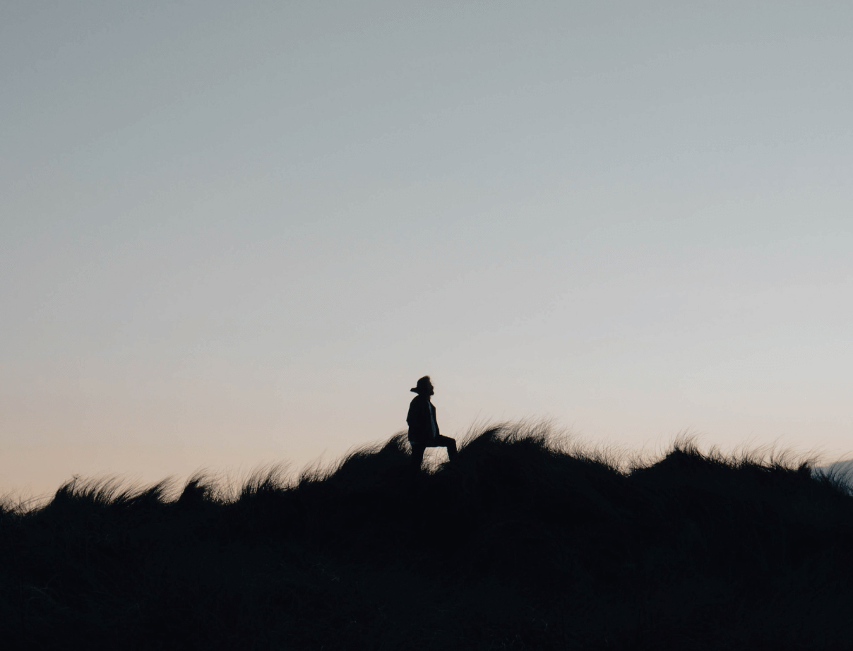 A person hiking in morning twilight